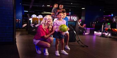 A family preparing to bowl at Hollywood Bowl. 